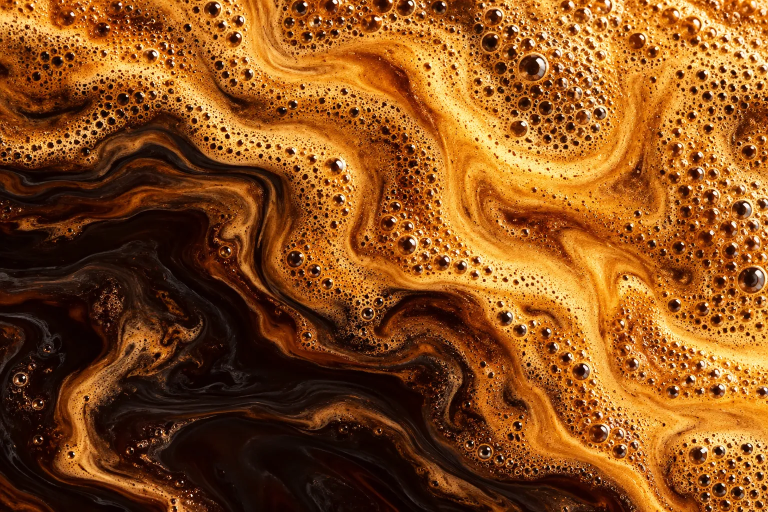 Golden crema bubbles and amber espresso in extreme close-up